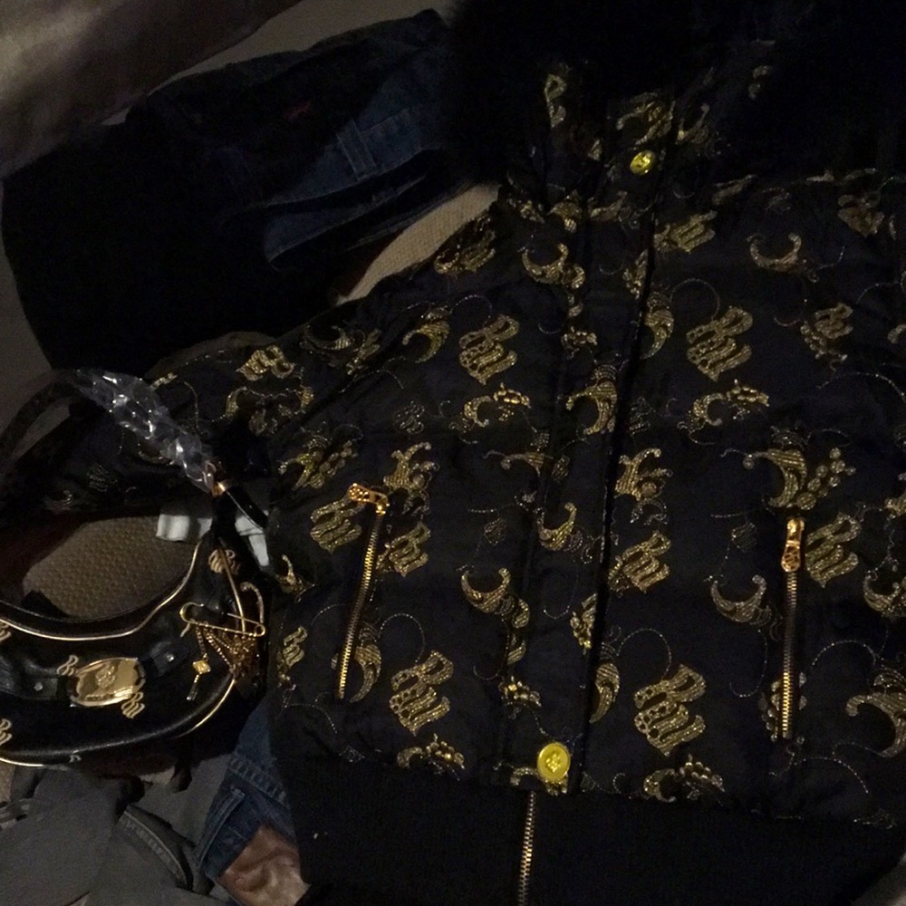 Black rocawear Ladies bomber with the authentic insignia embroidered in Gold,Lrg